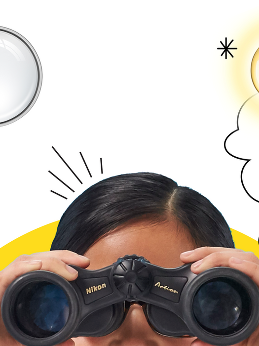 Child holding binoculars with lightbulb above their head