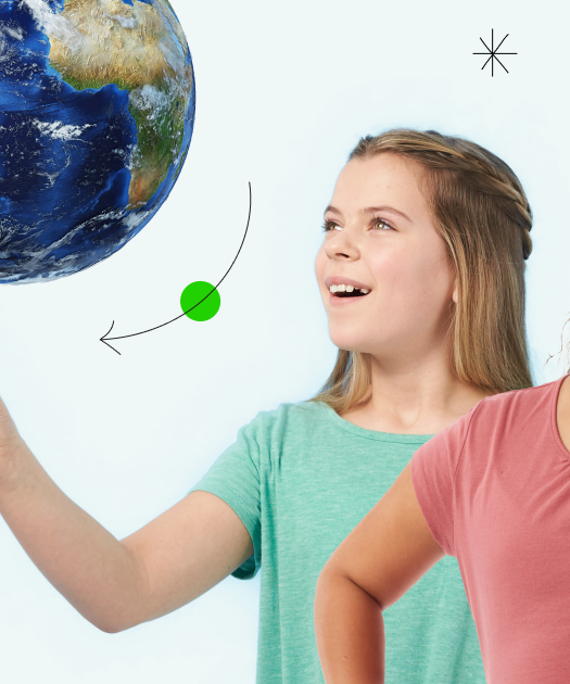 Two children pointing at a globe
